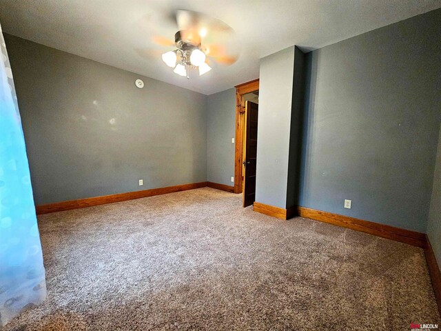 interior space with ceiling fan and carpet flooring