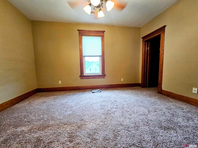 carpeted empty room with ceiling fan