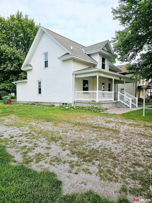 back of property featuring a porch