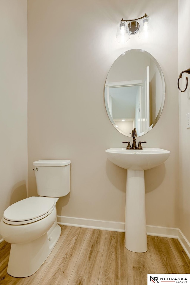 bathroom featuring toilet and hardwood / wood-style flooring