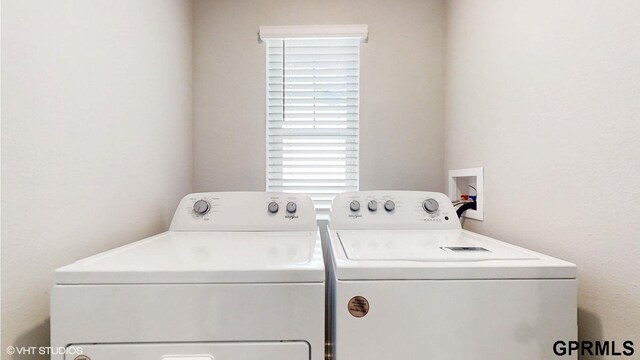 laundry room with separate washer and dryer