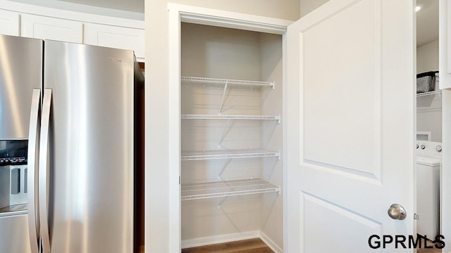 pantry featuring washer / dryer