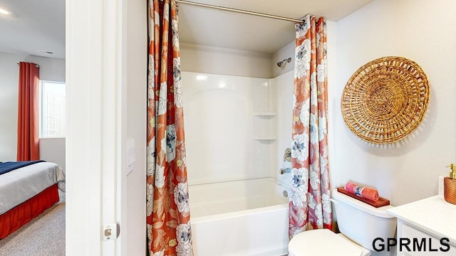 full bathroom featuring vanity, shower / bath combination with curtain, and toilet