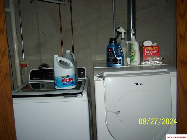 washroom with independent washer and dryer