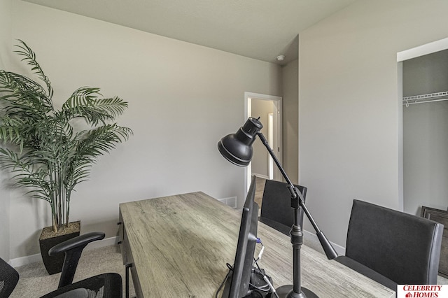 workout room featuring baseboards