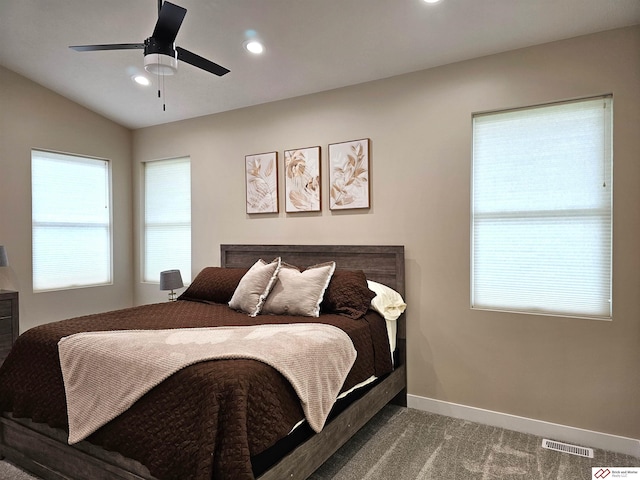 bedroom featuring carpet, lofted ceiling, and ceiling fan