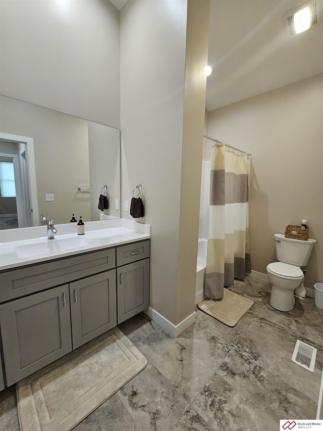 full bathroom featuring vanity, toilet, and shower / tub combo with curtain