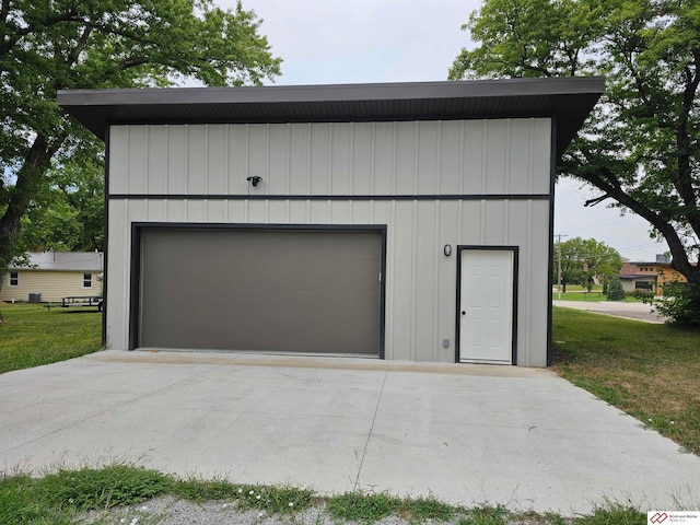 garage featuring a yard