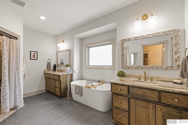 bathroom with vanity and a bathtub