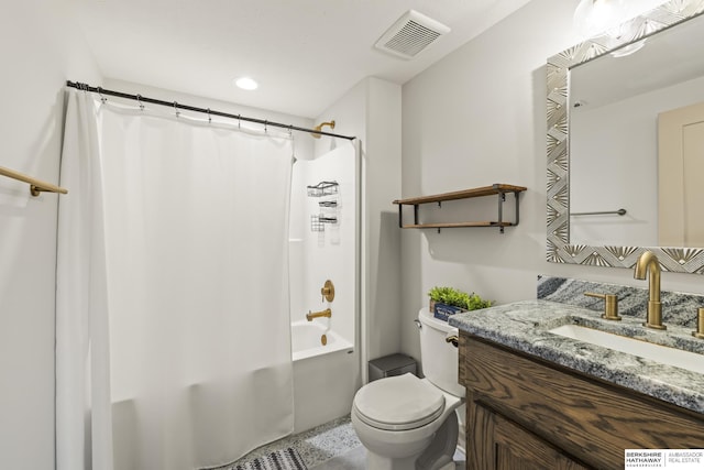 full bathroom with vanity, shower / tub combo, and toilet