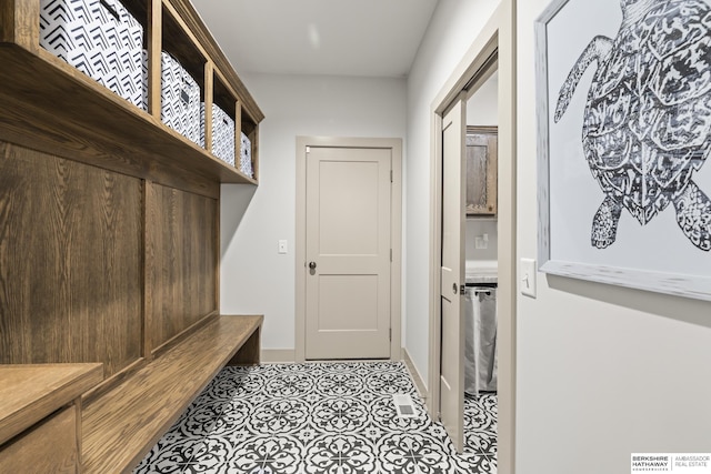 mudroom with light tile patterned flooring