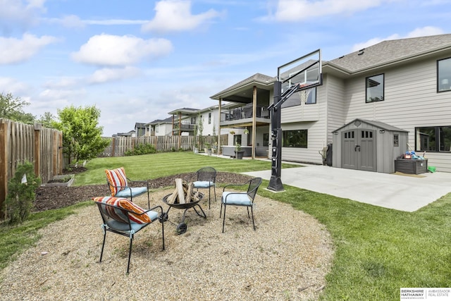 view of yard featuring a storage unit and a patio area