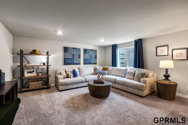 living area featuring carpet floors, baseboards, and recessed lighting