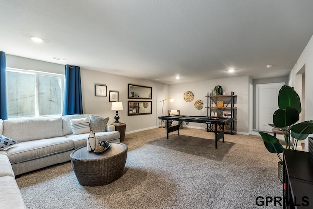 carpeted living area featuring baseboards and recessed lighting