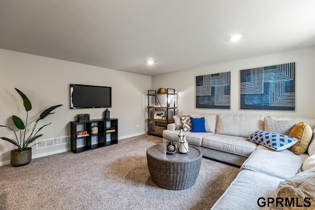 carpeted living room with visible vents, baseboards, and recessed lighting