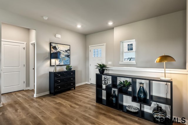 office featuring recessed lighting, wood finished floors, and baseboards