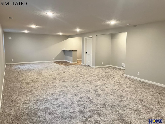 basement featuring carpet flooring