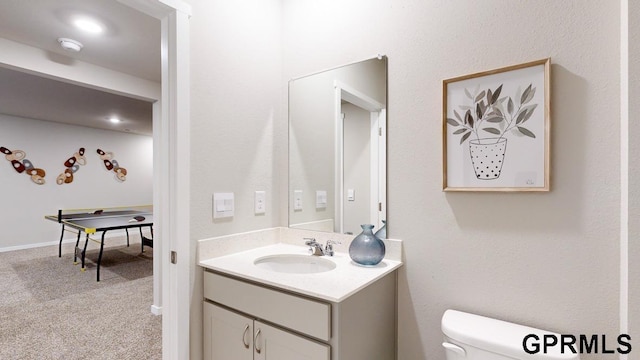 bathroom with toilet and vanity