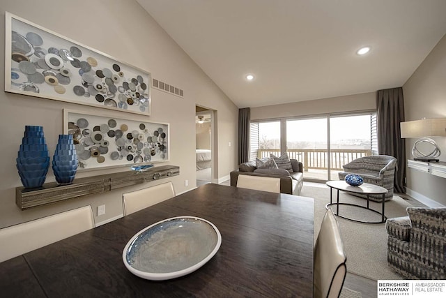 dining space featuring vaulted ceiling, carpet flooring, visible vents, and recessed lighting