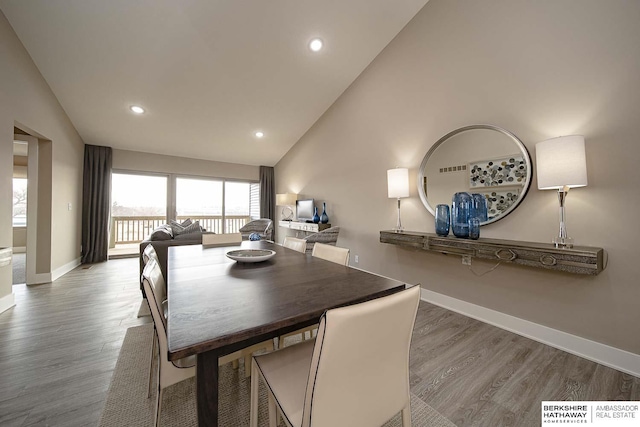 dining area featuring recessed lighting, wood finished floors, and baseboards