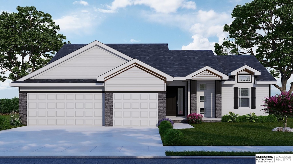 view of front of house featuring a garage and a front lawn