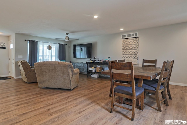 dining space with recessed lighting, visible vents, light wood-style flooring, a ceiling fan, and baseboards