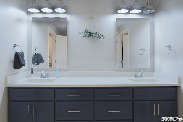 bathroom with double vanity and a sink