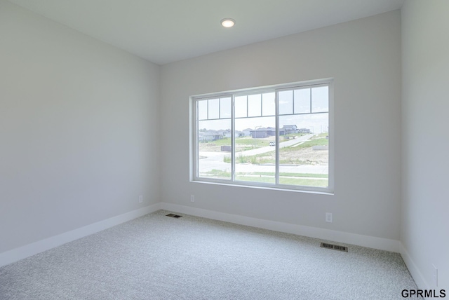 spare room featuring carpet flooring