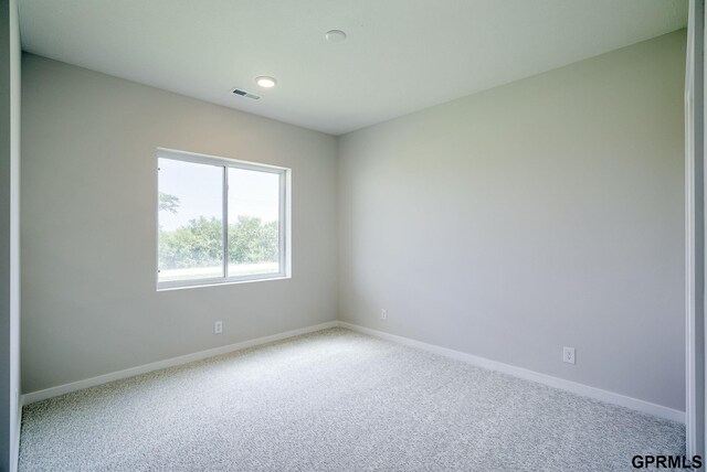 empty room featuring carpet floors