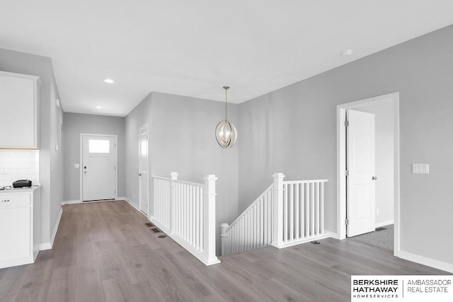 10210 S 110th Ave, Papillion, NE 68046 - foyer entrance featuring wood finished floors, a chandelier, and recessed lighting