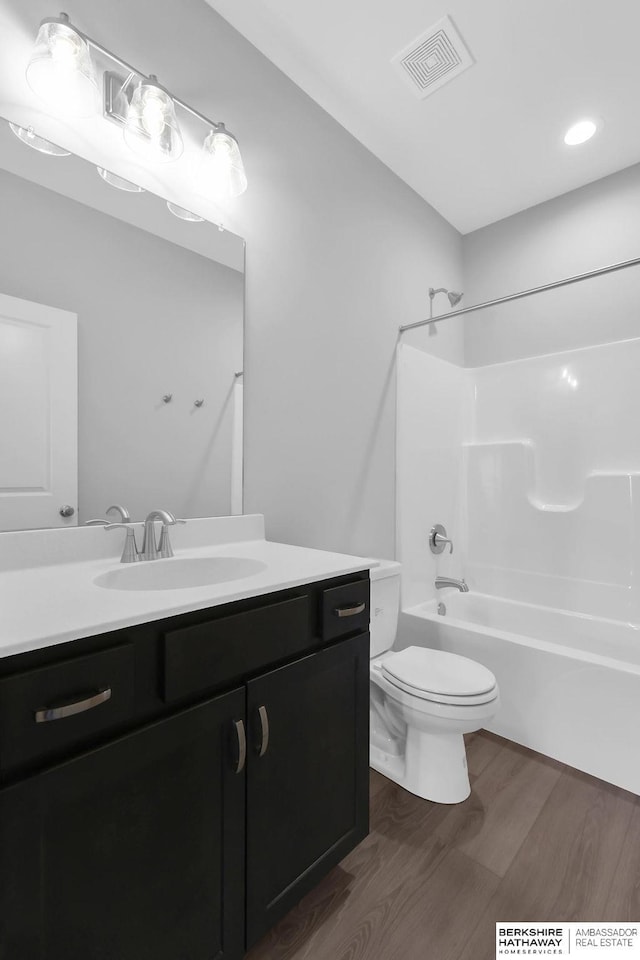 10210 S 110th Ave, Papillion, NE 68046 - bathroom featuring vanity, tub / shower combination, and wood finished floors