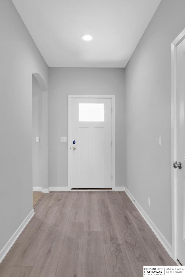 10210 S 110th Ave, Papillion, NE 68046 - foyer entrance with wood finished floors, arched walkways, and recessed lighting