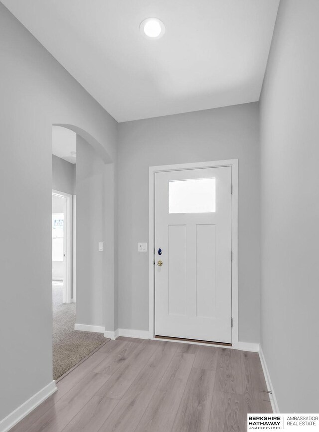 10210 S 110th Ave, Papillion, NE 68046 - entrance foyer featuring arched walkways and light wood finished floors