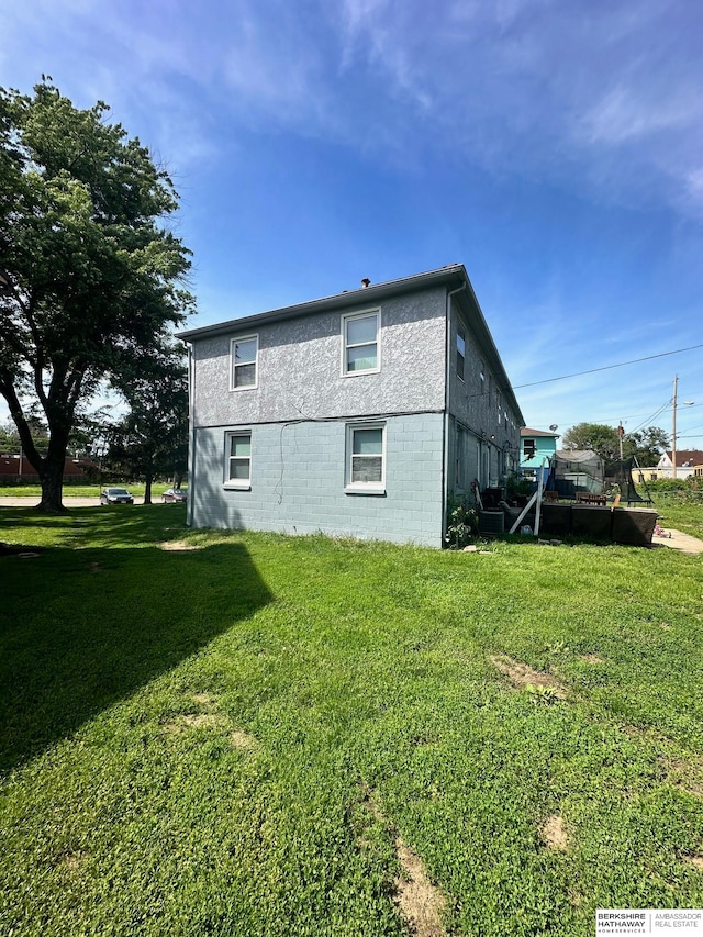 view of home's exterior featuring a lawn