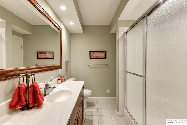 bathroom featuring vanity, toilet, a shower with shower door, and tile patterned flooring