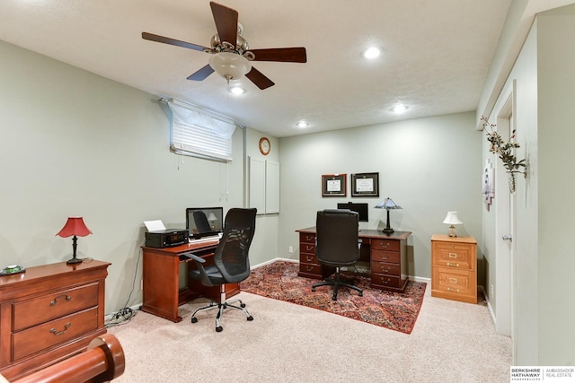 carpeted home office with ceiling fan