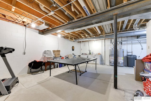 basement featuring water heater and washing machine and dryer