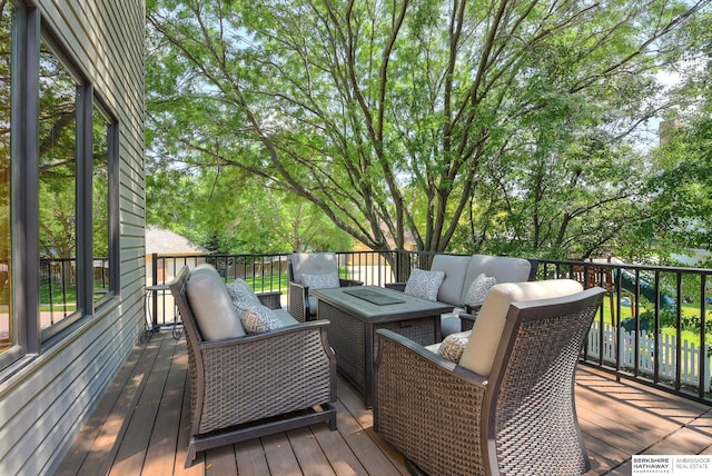 wooden deck featuring an outdoor living space