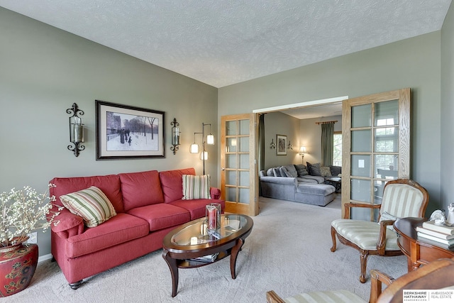 living room featuring a textured ceiling and carpet floors