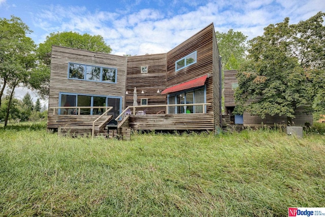 rear view of house with a deck