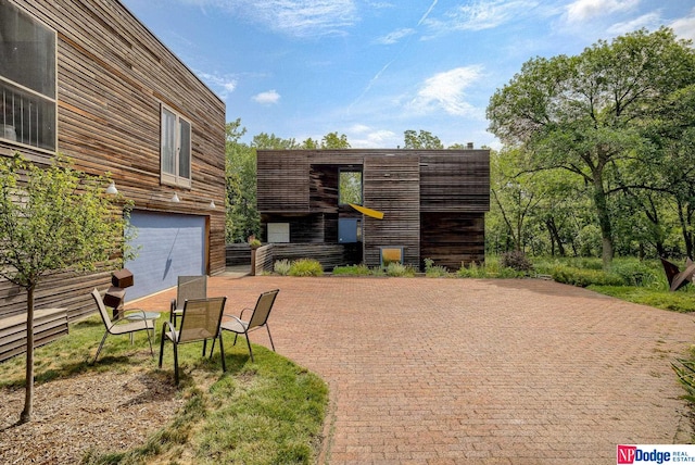 view of patio featuring a garage