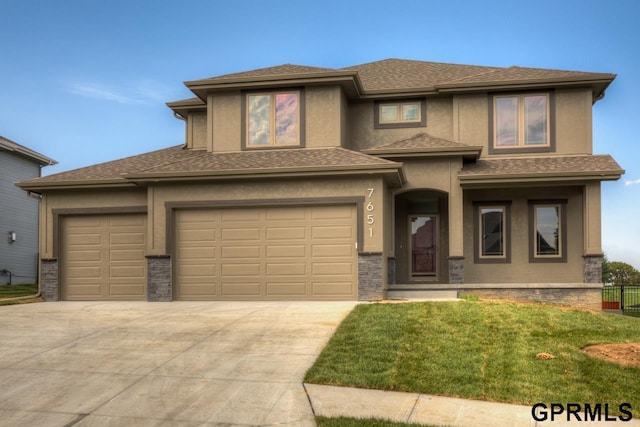 prairie-style house featuring a front yard