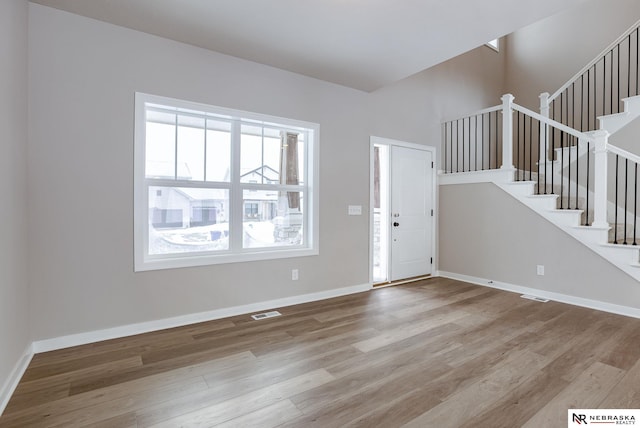 entryway with light hardwood / wood-style flooring