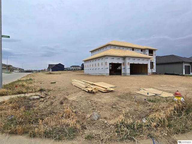 unfinished property featuring a garage