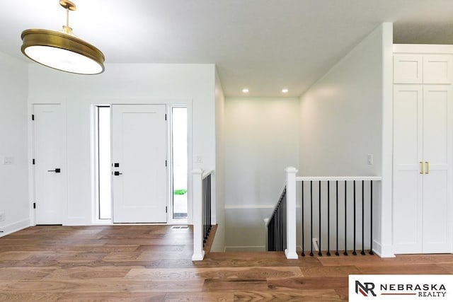 entrance foyer with wood finished floors and recessed lighting