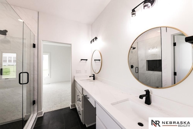 bathroom with double vanity, tile patterned flooring, a sink, and a shower stall