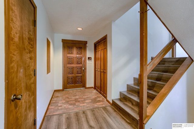 entryway with light hardwood / wood-style floors