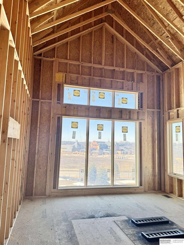 misc room with visible vents and high vaulted ceiling