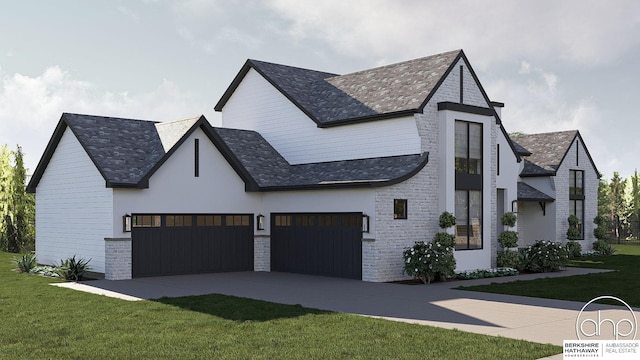 view of front of home featuring a garage and a front yard