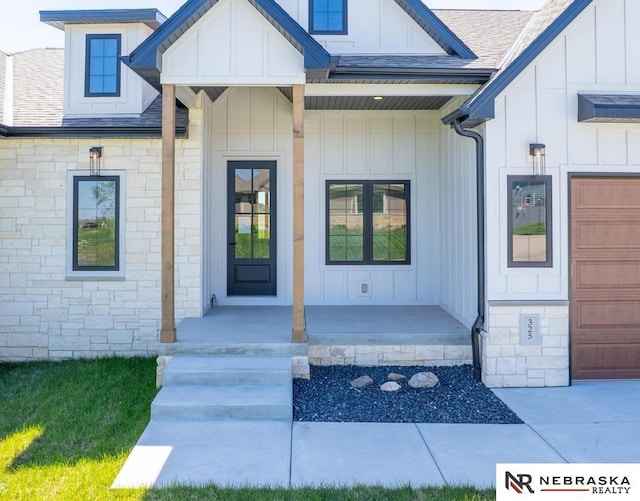 325 S Lakeview Way, Ashland, NE 68003 - view of exterior entry featuring board and batten siding, covered porch, and roof with shingles